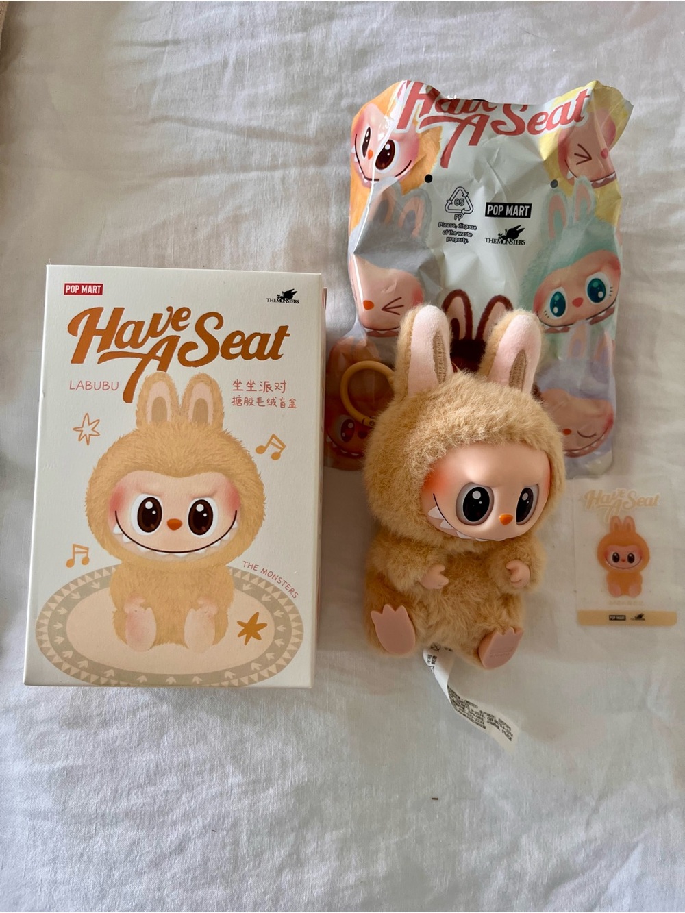 POP MART Labubu Plush Figure - Beige Have A Seat Collectible